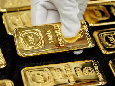 Gold Prices Tumble as U.S. Dollar Flexes Muscle: What This Means for Canadian Investors
