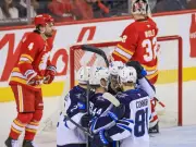 Flames' Honzek Injured in 4-3 Shootout Loss to Jets