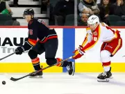 Flames Prospect Gridin Excels in AHL, Aims for NHL Return