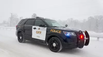 Two hospitalized, driver charged after vehicle rolls into ditch near Barrie