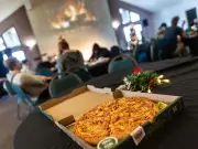 Calgary's Homeless Find Warmth, Pizza at Church Amid Christmas Chill