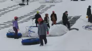 New Canadians Experience First Winter Tubing with Waterloo Regional Police