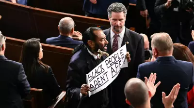 Rep. Al Green Confronts Trump with 'Black People Aren't Apes' Sign at SOTU