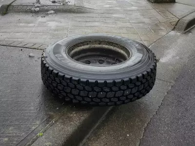 Dump Truck Loses Wheels on Barnet Highway, One Strikes Vehicle in Port Moody