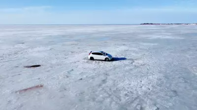 Helicopter and Snowmobiles Retrieve Car Abandoned on Sea Ice Near Nova Scotia
