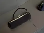 Coach's Spring Handbag Trends: East-West Silhouettes and Book Charms Lead