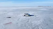Helicopter and Snowmobiles Retrieve Car Abandoned on Sea Ice Near Nova Scotia