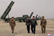 North Korean Leader Kim Jong Un Oversees Rocket System Test with Daughter