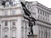 New Banksy Statue Appears in London: Man with Flag-Covered Face Draws Crowds