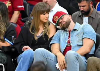 Taylor Swift Hides Face as Travis Kelce Chugs Beer at Cavs Game, Internet Reacts
