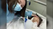 B.C. woman returns home after 2 months in induced coma in China