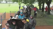 Hundreds Brave Rain for Forever Canadian Lawn Sign in Calgary