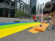 Regina Volunteers Paint LGBTQ+ Crosswalk to Kick Off Pride Month