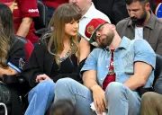 Taylor Swift Hides Face as Travis Kelce Chugs Beer at Cavs Game, Internet Reacts