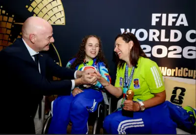 Blind volunteer in wheelchair wins FIFA Unsung Hero award at World Cup in Toronto