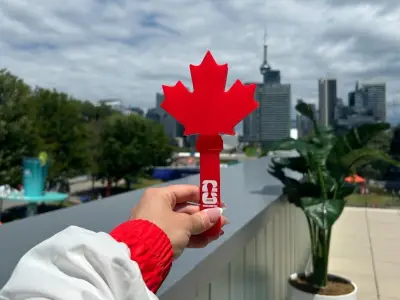 Canadian World Cup fans cheer with maple leaf-shaped clappers