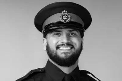 Slain OPP Officer's Body Flown to Coroner, Accused Killer Appears in Court