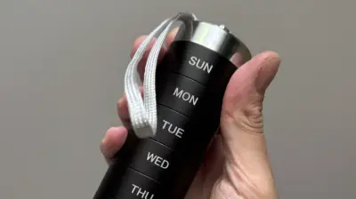 Sleek Aluminum Pill Organizer Holds 12 Pills Per Day, Won't Pop Open