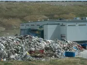 Drone footage questions landfill owner's waste pile cleanup claims