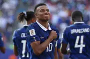 Mbappé scores twice, ties Messi with 6 World Cup goals as France beats Sweden 3-0