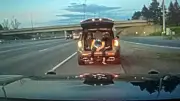 Passenger spotted sitting in open trunk of SUV filming cars on Ottawa highway