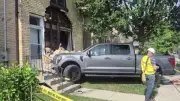 Two-Vehicle Crash Sends Pickup Truck into South London Home