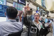 U.S. stocks waver as tech slips, oil prices extend decline