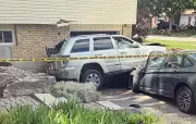 Driver Hits Home in Waterloo; Two Vehicles Damaged